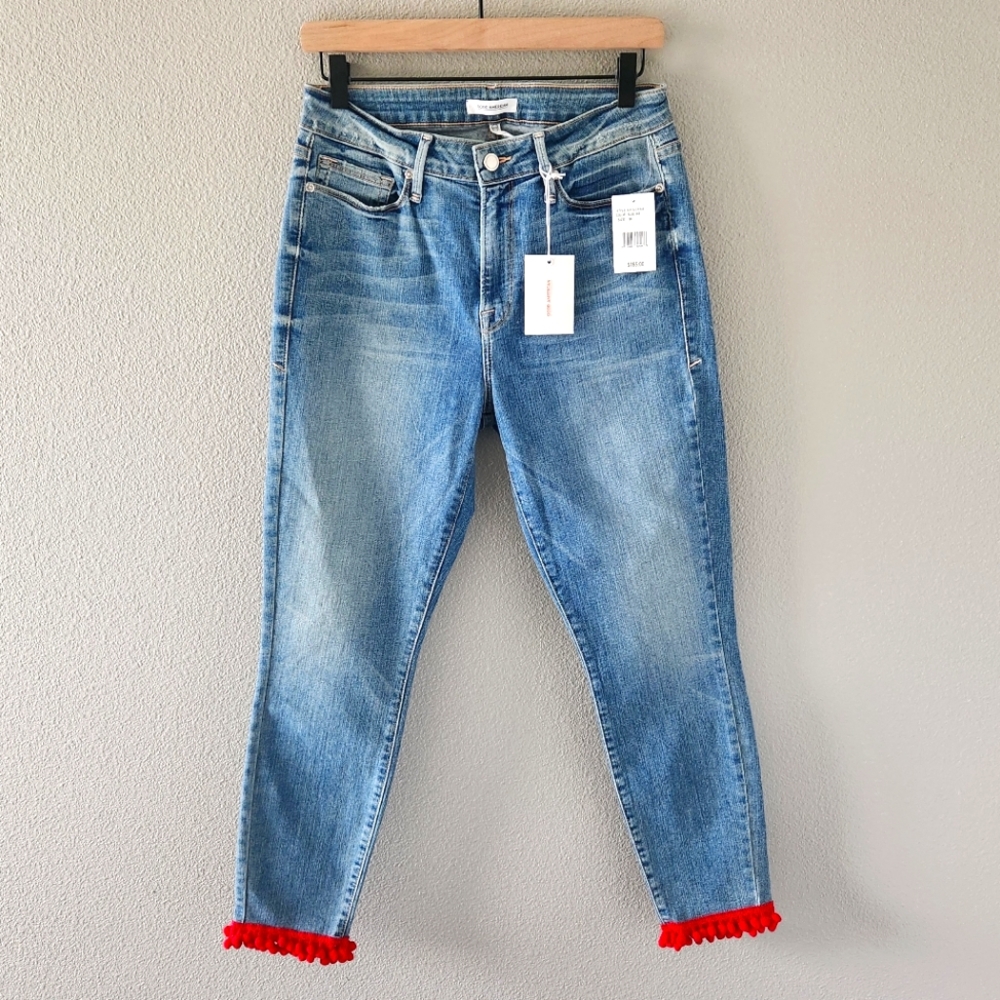 Women’s Light Blue Jeans with Red Pom Hem